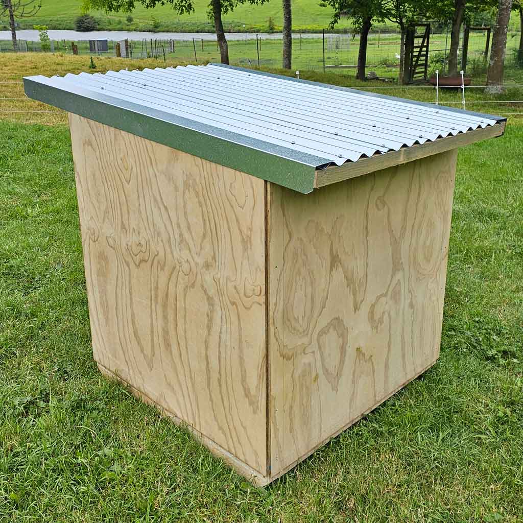 Appletons Timber Duck Cubby House back profile showing the galvanised iron roof with flashings