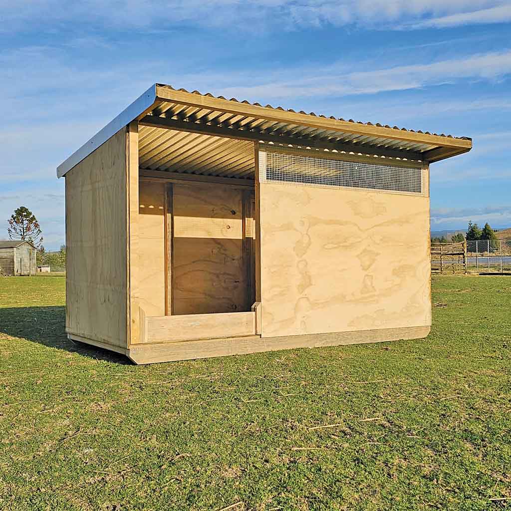 Appletons timber pig shelter with galvanised iron roof and flashings
