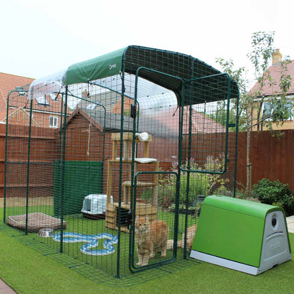 Green Eglu Go House connected to a Walk-in Catio Pet Run