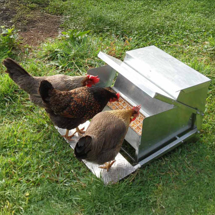 Its as easy as stepping on the treadle and the feeder automatically opens.
