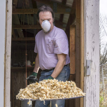 Use a face mask when cleaning the coop