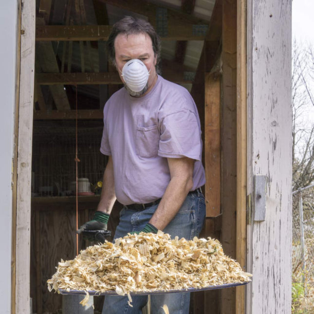 Use a face mask when cleaning the coop
