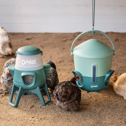 Omlet 2.5kg no waste chicken feeder next to the Omlet insulated chicken drinker
