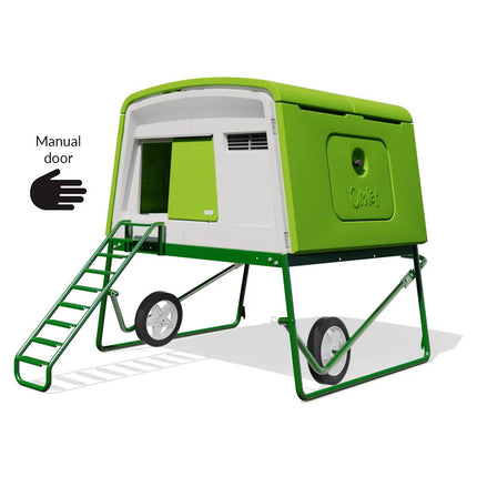 Green Eglu Cube chicken coop with wheels and manual door